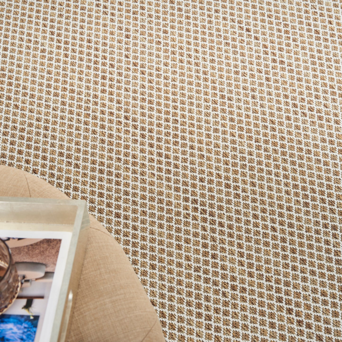 Beige woven rug with tan and white check grid; round 8' diameter.