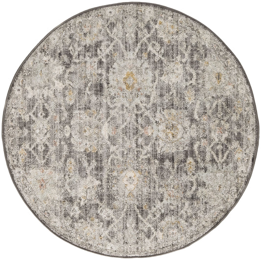 Round gray distressed rug with faded floral pattern and subtle yellow accents.