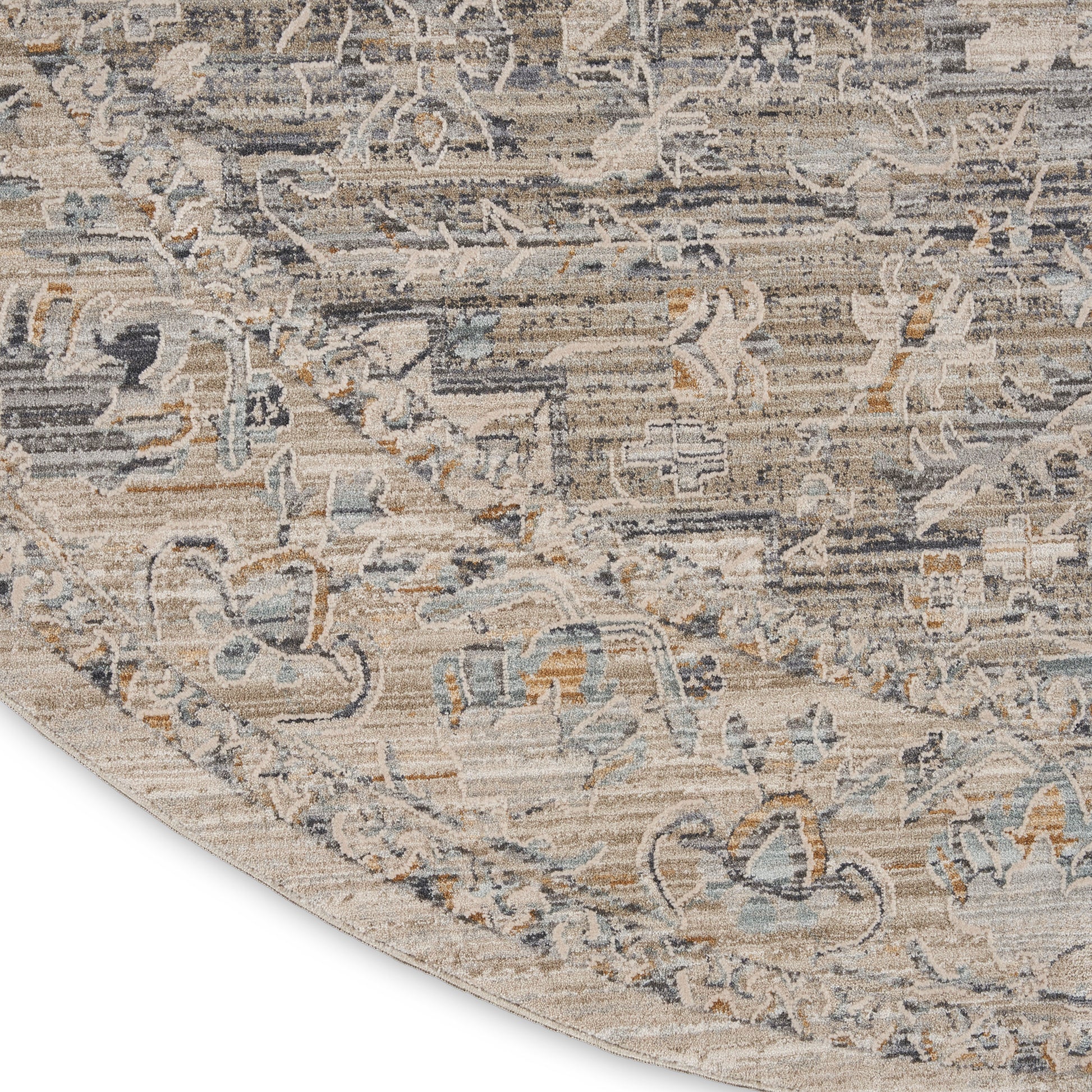 Beige distressed oriental rug with blue-gray floral motifs and tan accents; curved corner reveal.
