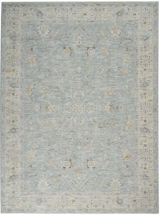 Rectangular light-blue Persian-style rug with ivory border and pale floral vines for traditional living spaces.
