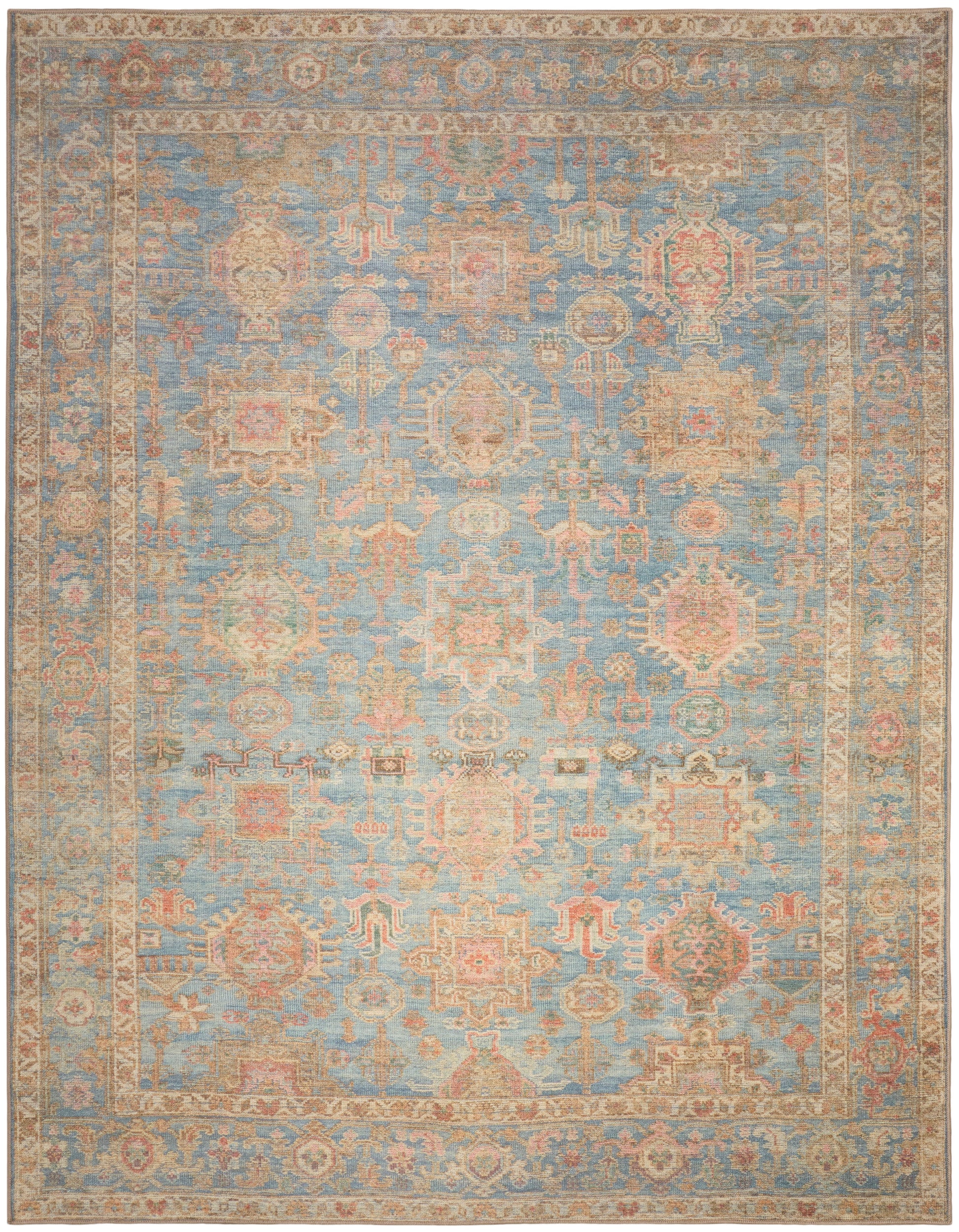Rectangular blue and beige distressed Persian-style area rug with ornate floral motifs and decorative border.