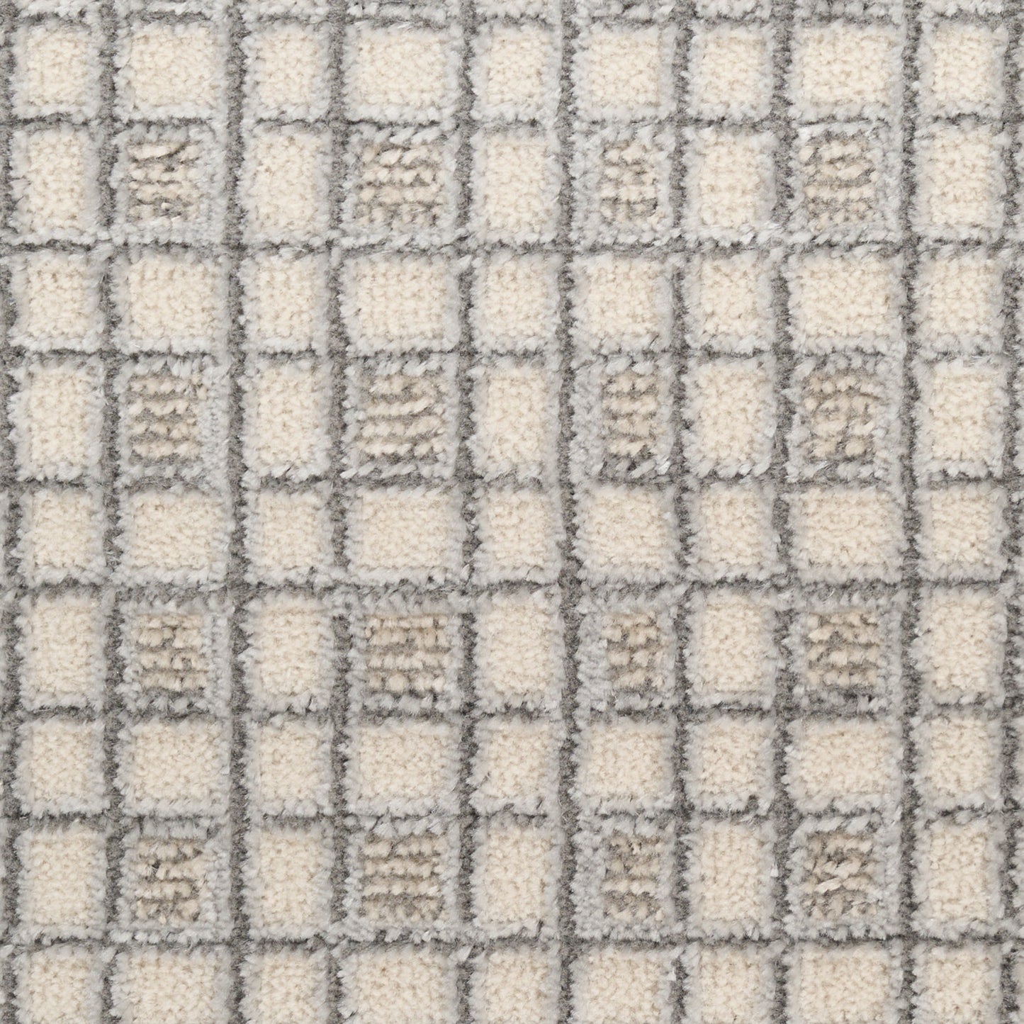 Cream and light-gray checkerboard tufted rug with soft pile for modern home decor.