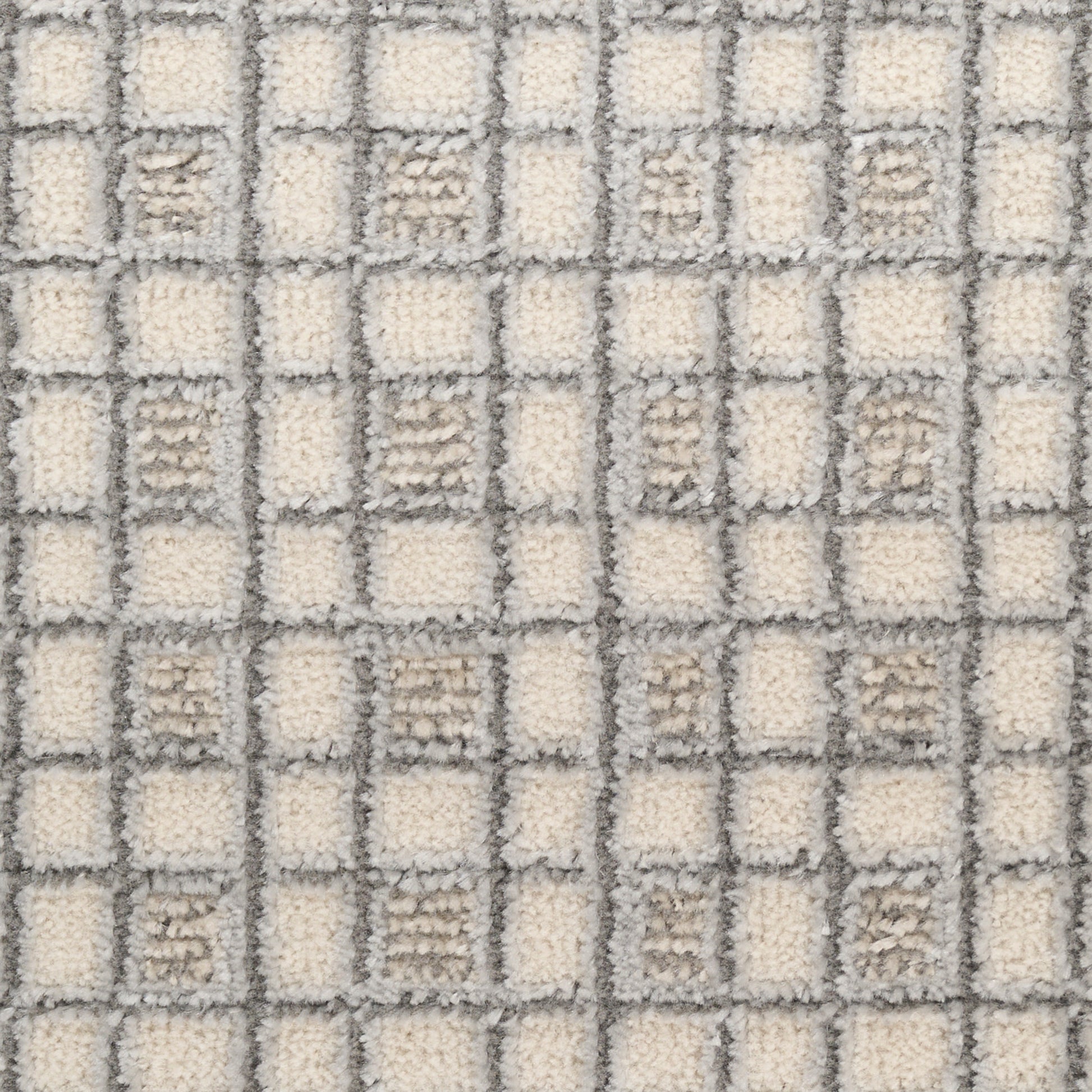 Cream and light-gray checkerboard tufted rug with soft pile for modern home decor.
