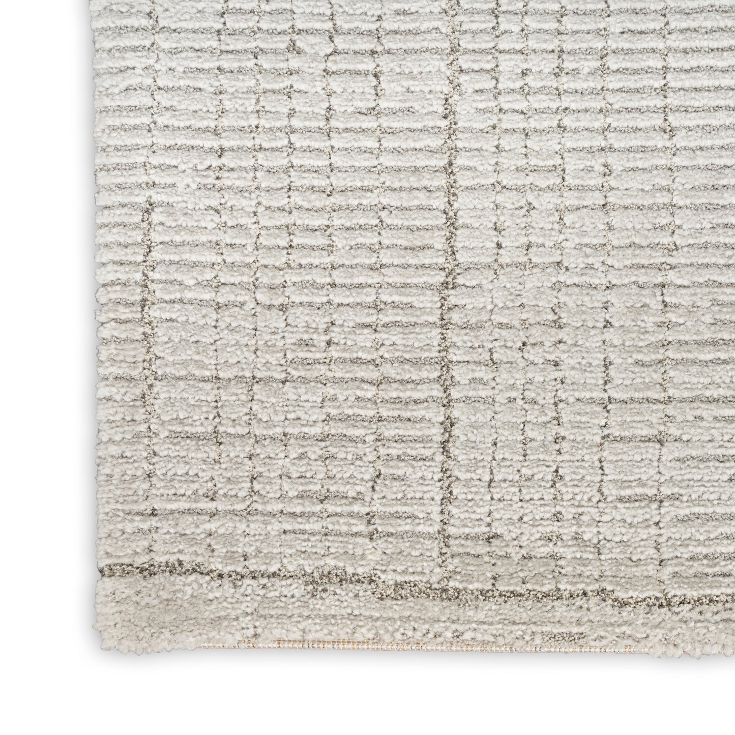Cream textured area rug with geometric grid pattern & plush pile, light border trim.