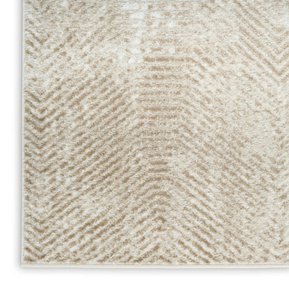 Beige and cream chevron-pattern plush rug with soft pile; rectangular, modern cozy decor.