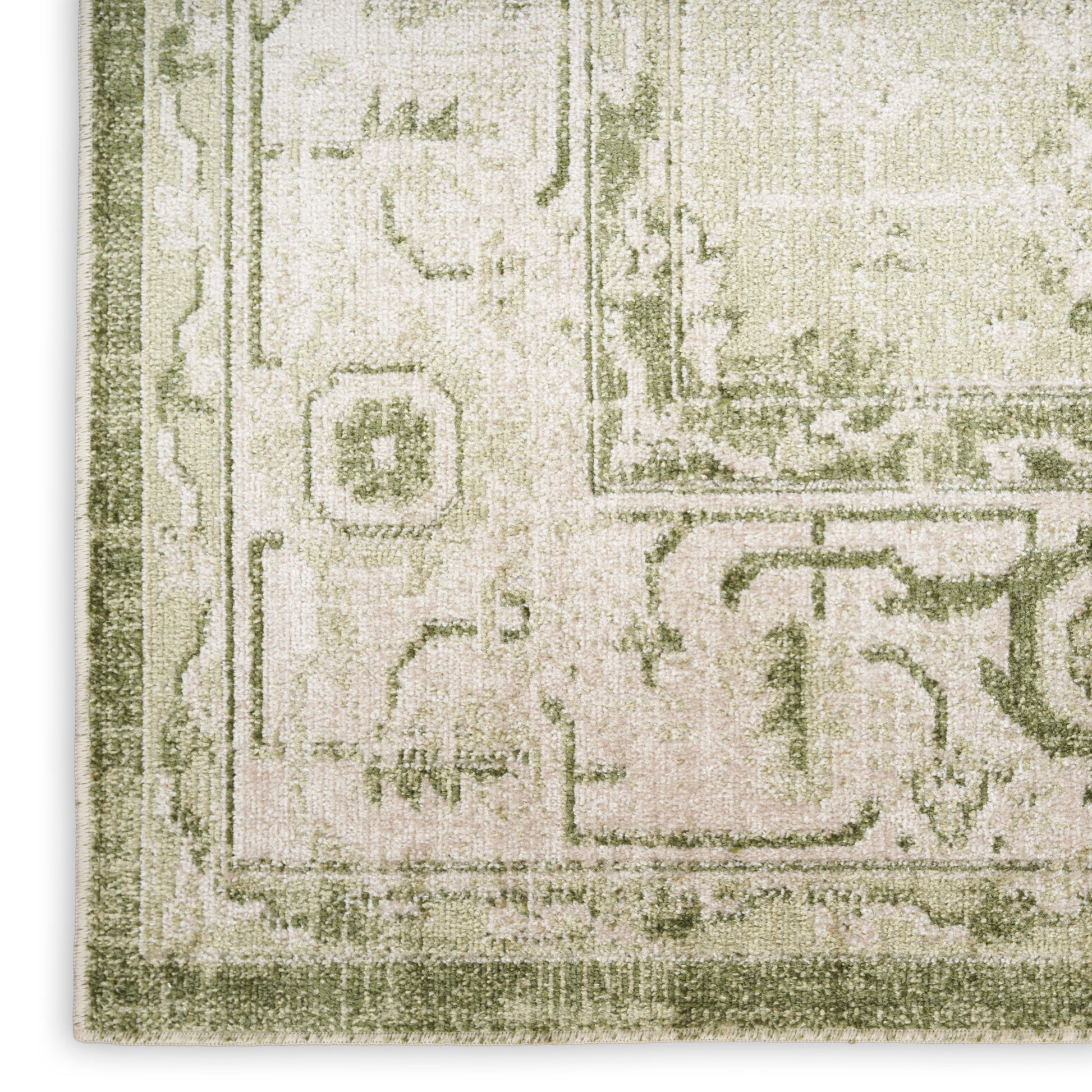 Muted green and beige oriental runner with distressed floral motifs and decorative border.