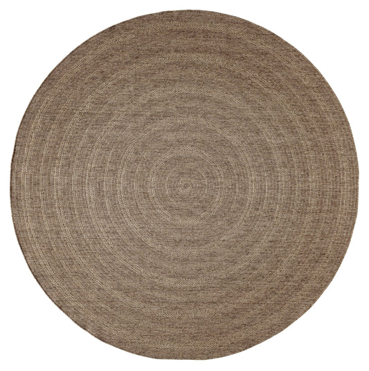 Natural round jute rug with braided concentric rings in warm beige-brown, rustic boho style.