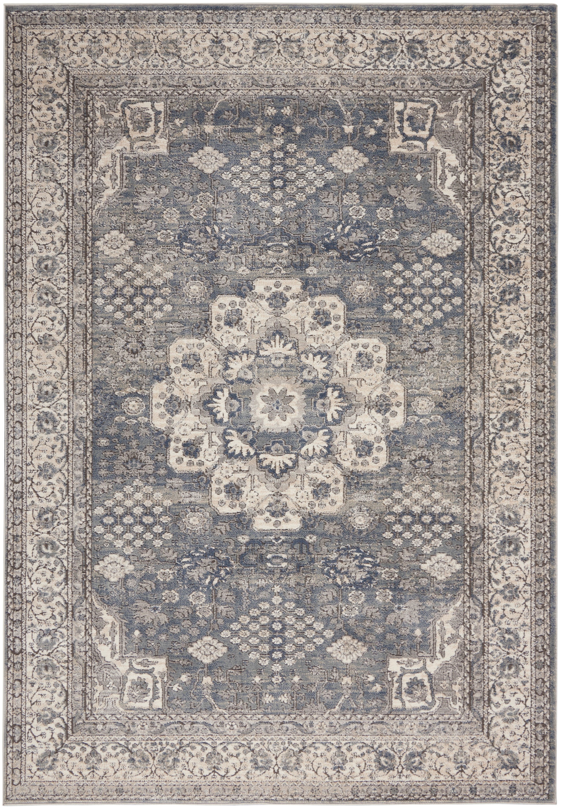 Rectangular traditional oriental rug with blue-gray field, cream central medallion and ornate cream borders.