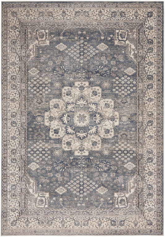 Rectangular traditional oriental rug with blue-gray field, cream central medallion and ornate cream borders.