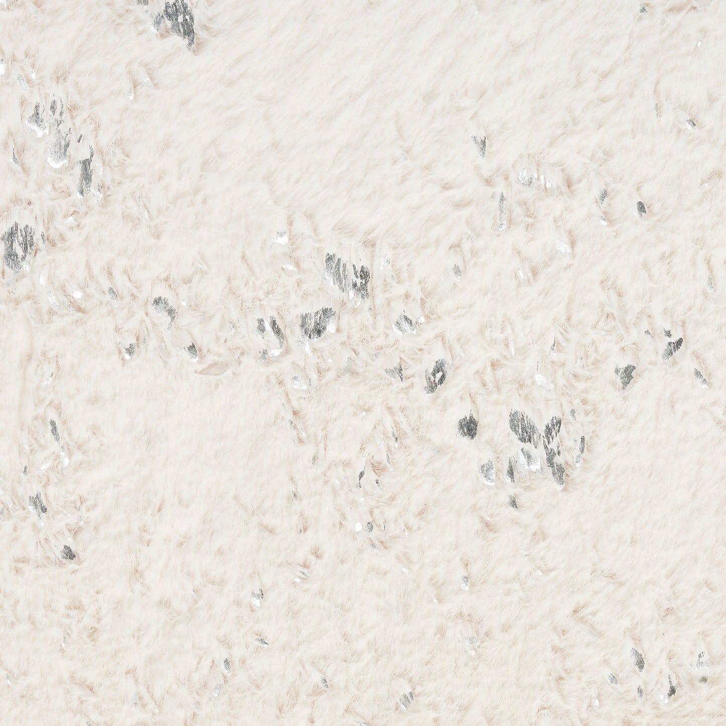 Cream terrazzo-style surface with pale beige base and scattered silver-gray flecks.