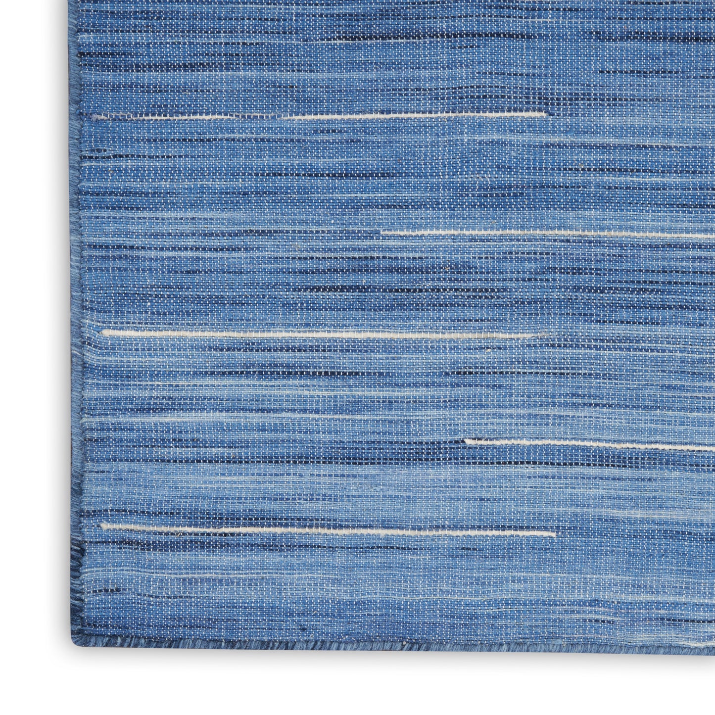 Blue woven rug with subtle white horizontal stripes and a denim-like textured weave.