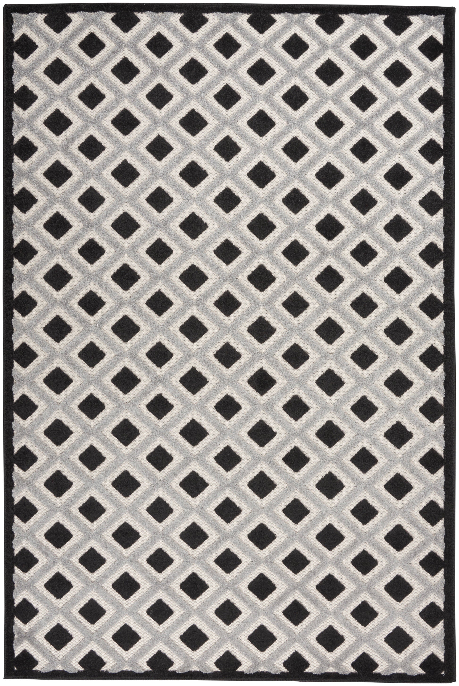 Geometric rug with a repeating diamond lattice in white/cream on pale gray, framed by a black border.