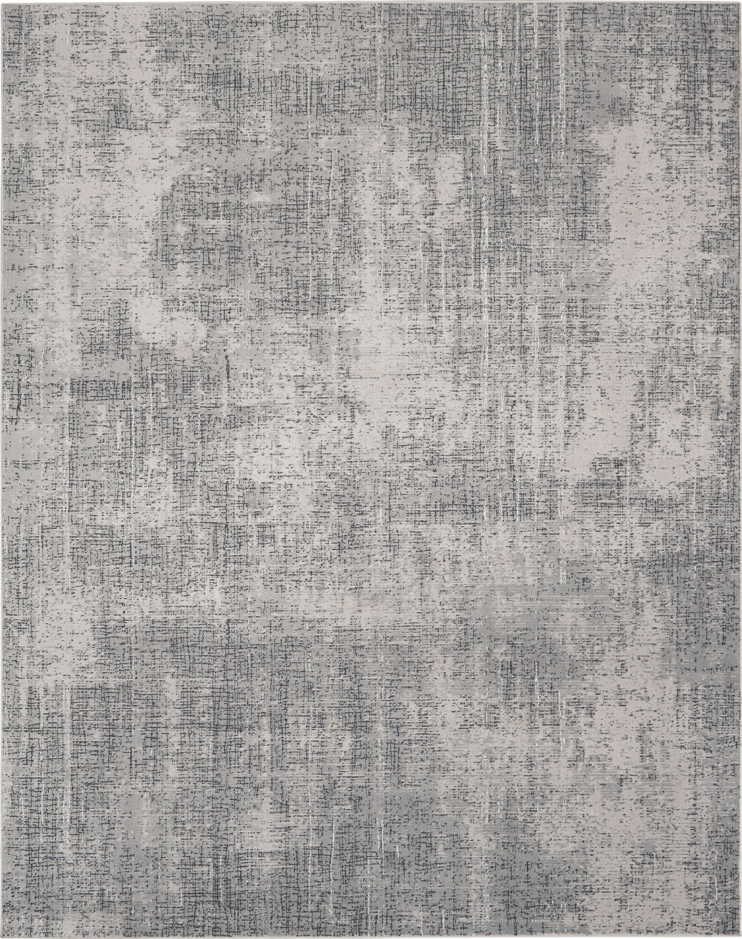 Rectangular gray area rug with abstract, distressed pattern in light and dark gray tones; modern living room decor.