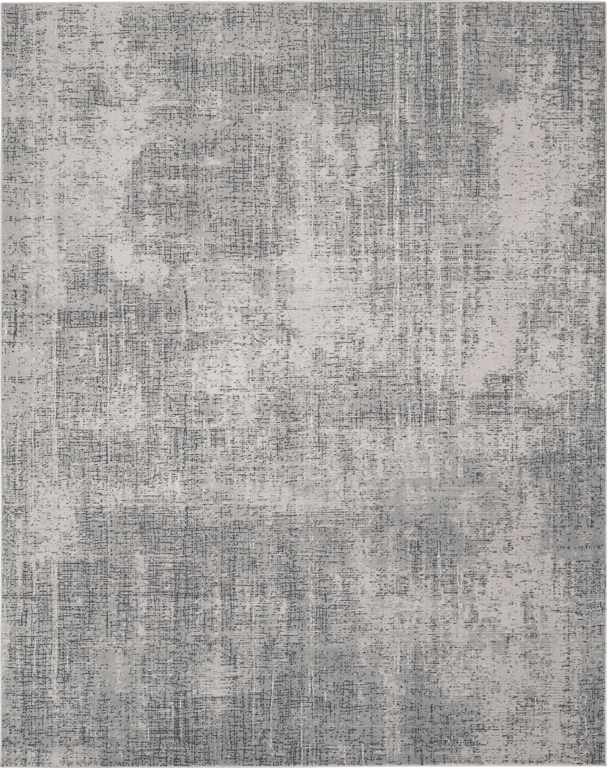 Rectangular gray area rug with abstract, distressed pattern in light and dark gray tones; modern living room decor.