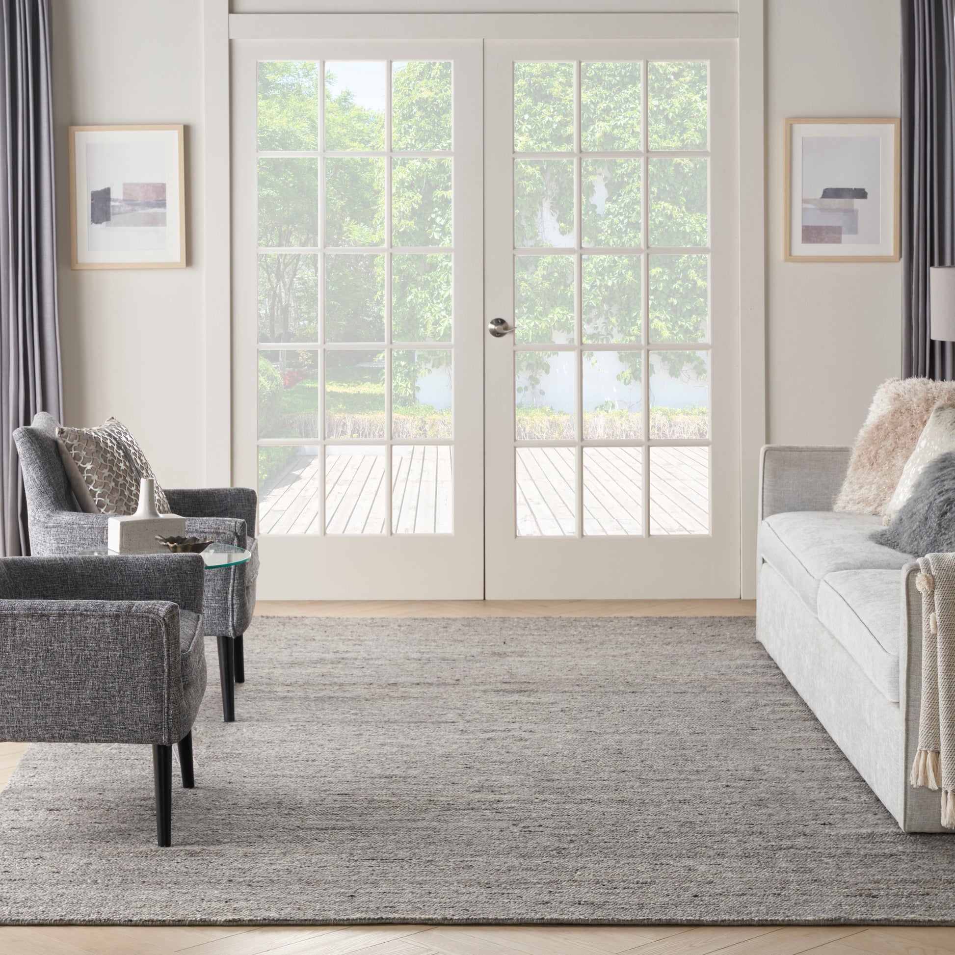Light gray neutral rug, 10' x 14'.