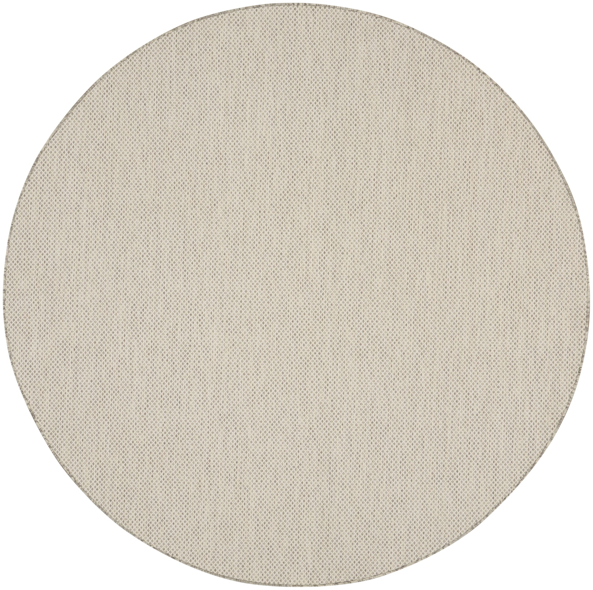 Beige round woven rug.