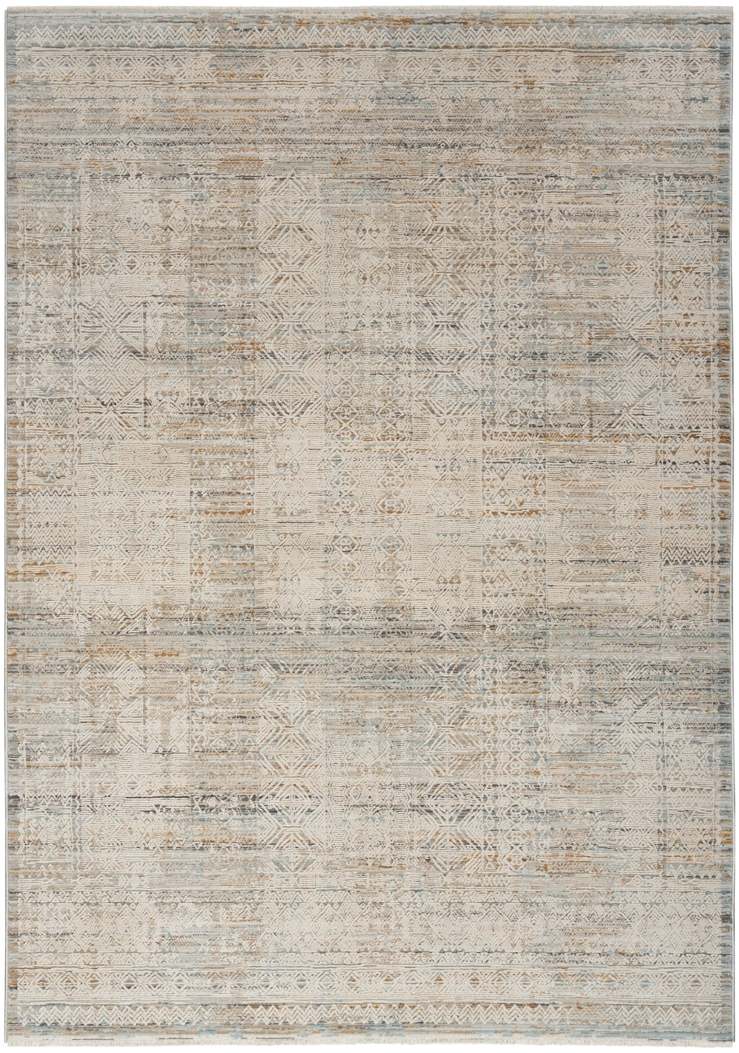 Distressed patchwork area rug with muted geometric motifs in beige, ivory, gray and pale blue.
