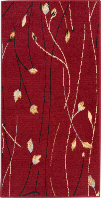 Red rectangular area rug with abstract black and ivory vine lines and pale yellow leaves.