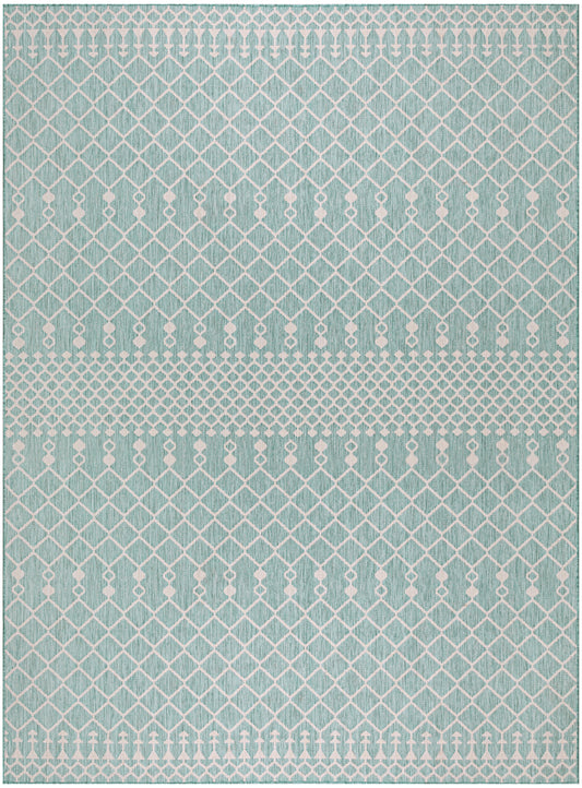 Teal rug with white diamond lattice pattern and border bands of small arrow-like motifs.