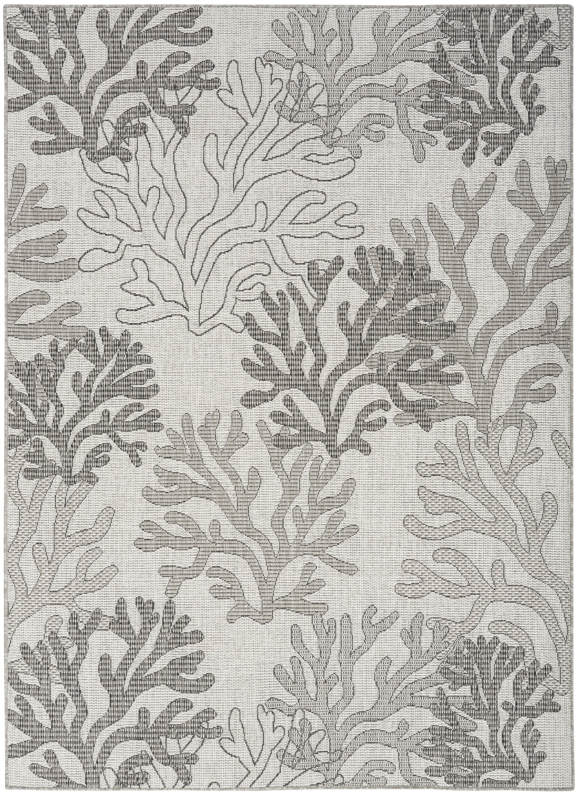Grey and ivory coral-pattern rug with woven texture and organic branch shapes, coastal-style.
