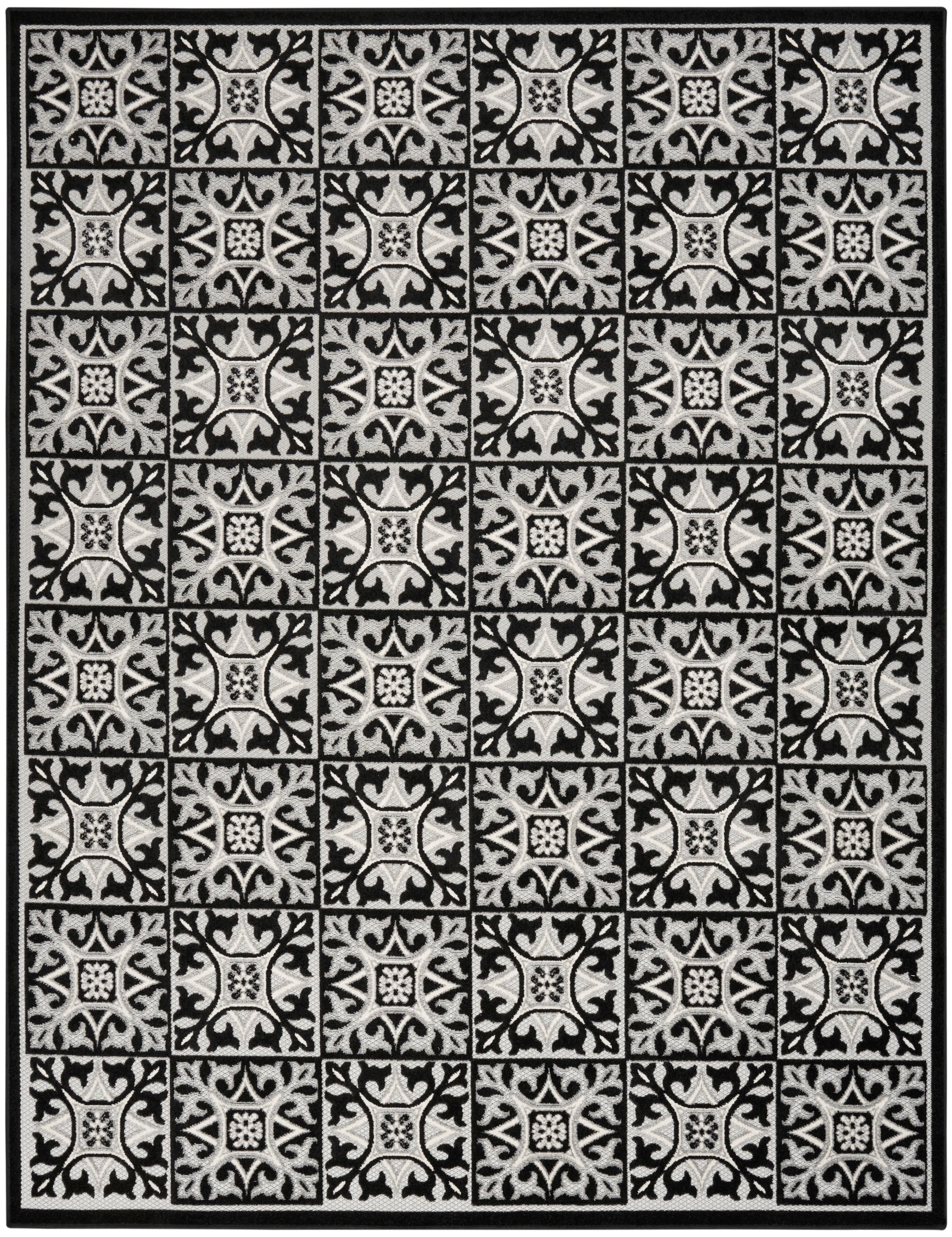 Ivory and black rug with repeating square tile motifs featuring ornate floral scrolls; black border.