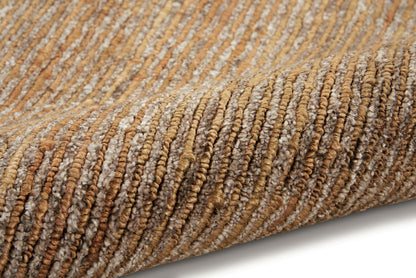 Rolled ribbed rug in warm beige and brown tones, looped texture with natural jute-like fibers.