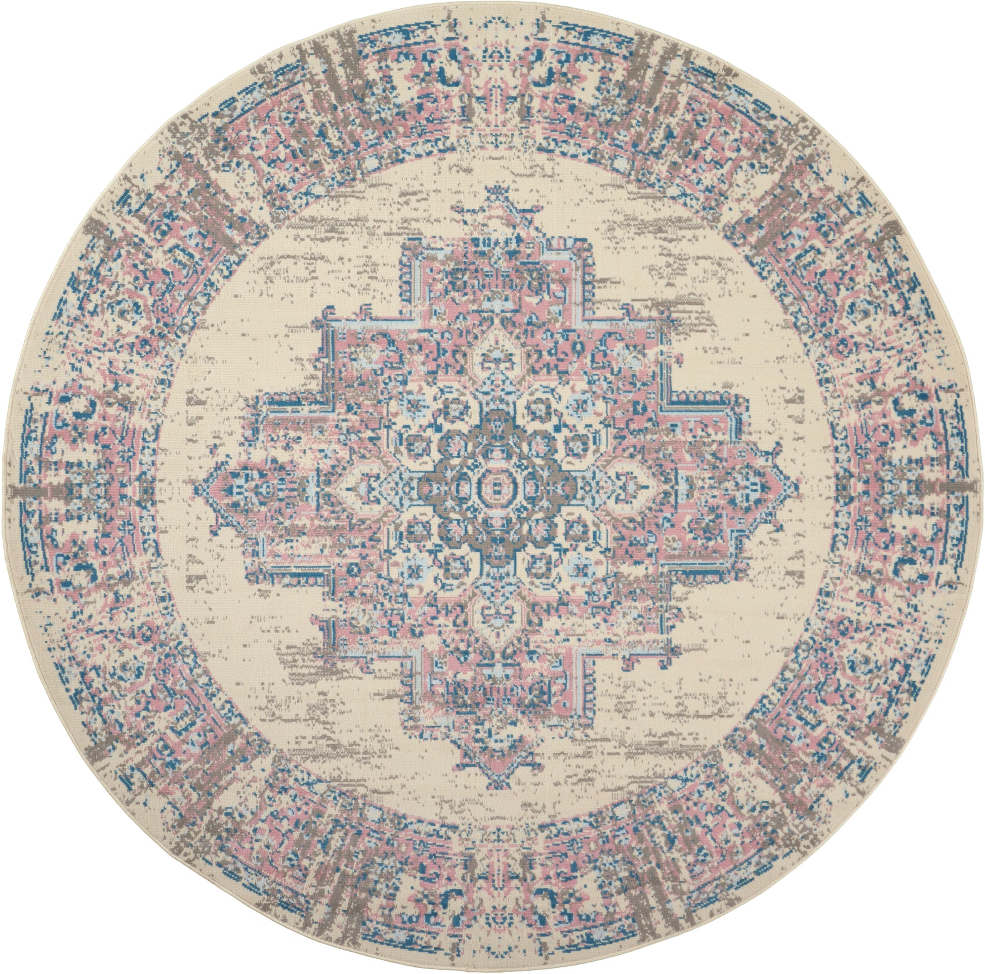 Round distressed beige rug with pink & blue ornate central medallion & decorative border.