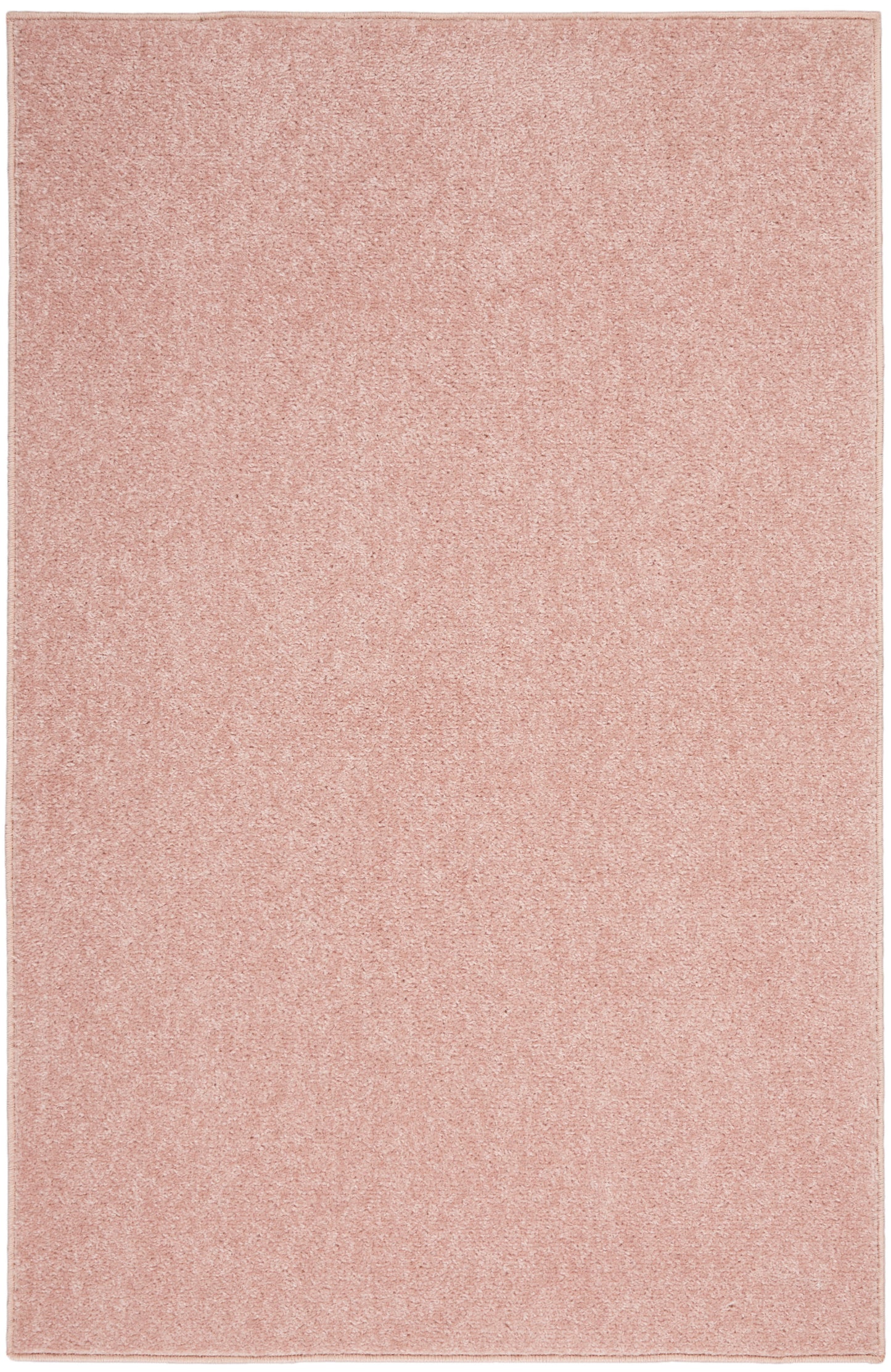 Soft pink rectangular outdoor rug with even pile texture, 2' x 4'.