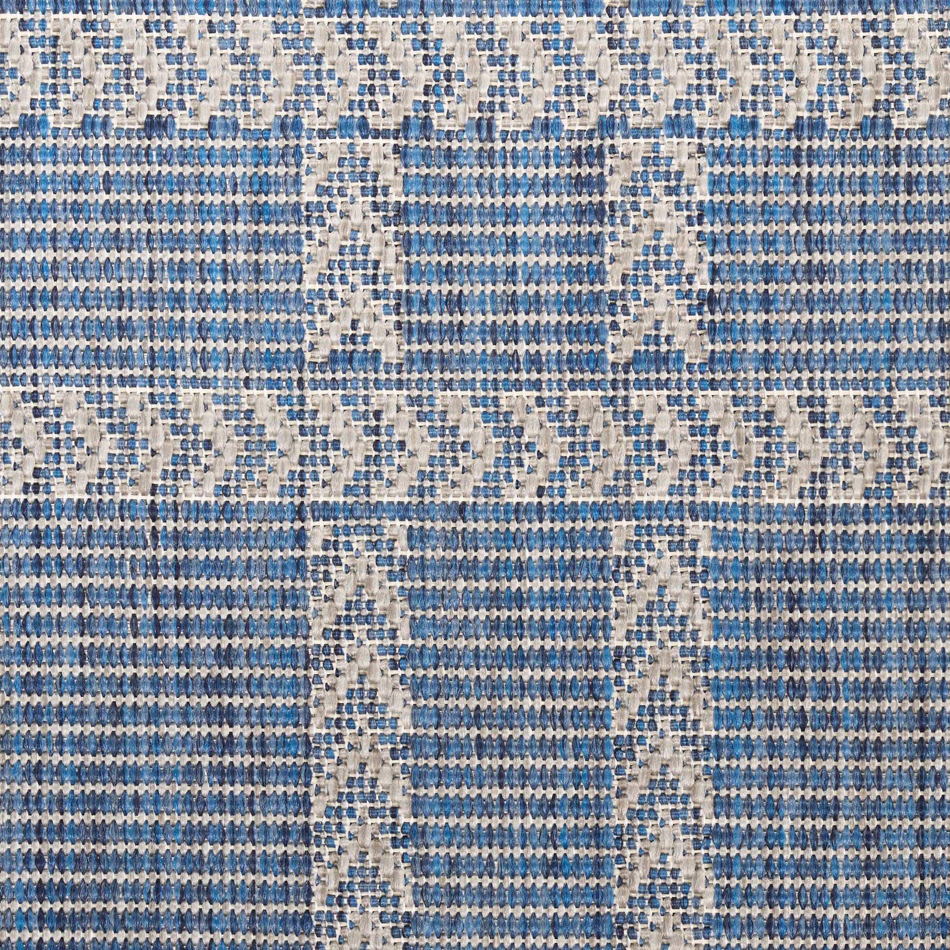 Blue and white woven textile with a geometric border framing a solid blue panel, scarf or wall hanging.