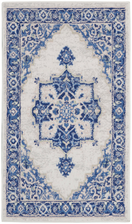 Blue and white oriental rug with intricate floral border and central medallion, distressed look, rectangular area rug.