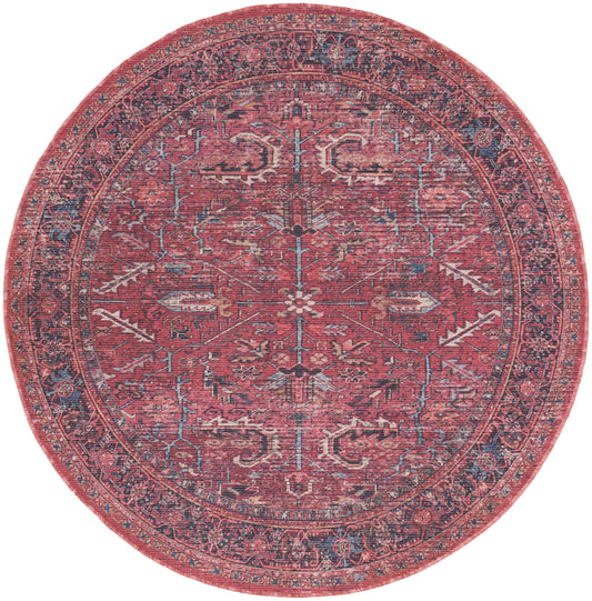 Round red rug with navy blue border, distressed vintage floral and geometric medallion pattern.