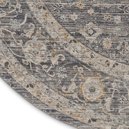 Antique blue-gray oriental rug with cream, beige, and pale gold floral Paisley pattern; curved corner.