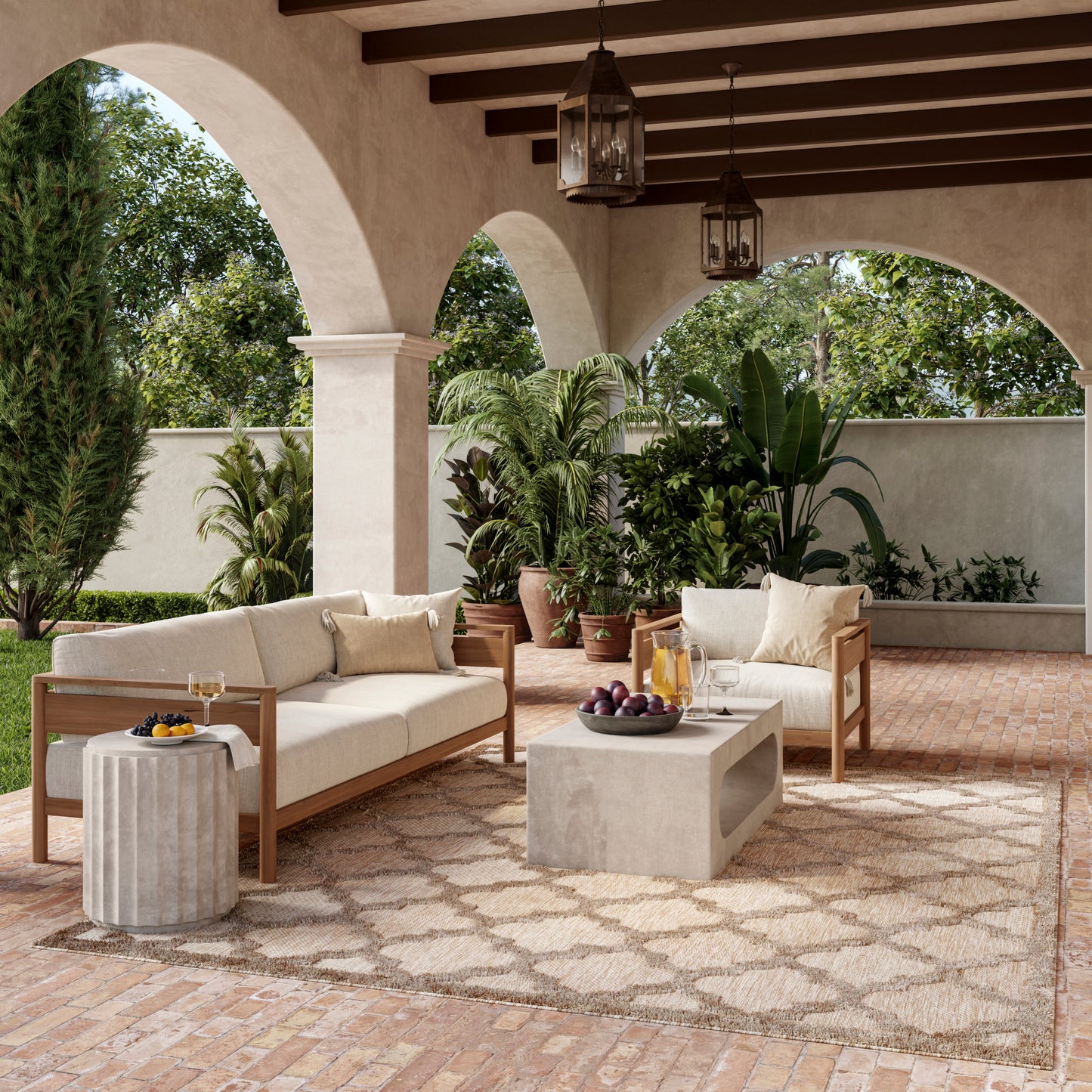 Outdoor patio with beige cushioned wooden sofas, concrete coffee table, tan patterned rug, and potted plants under arches.
