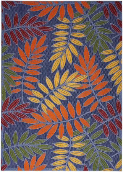 Woven rug featuring bright orange, yellow, green and maroon leaves on a navy background.