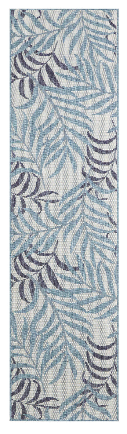 Woven runner rug with blue and navy fern leaves on a light gray background.