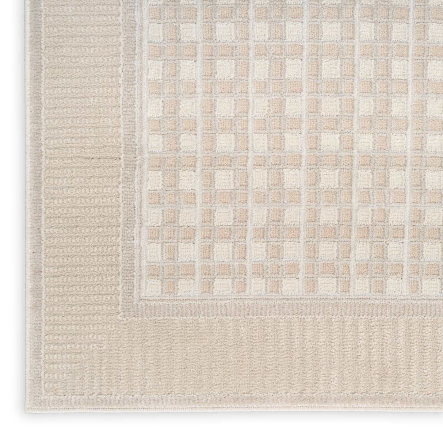 Beige and cream flatwoven rug with a tiled grid pattern and ribbed border.