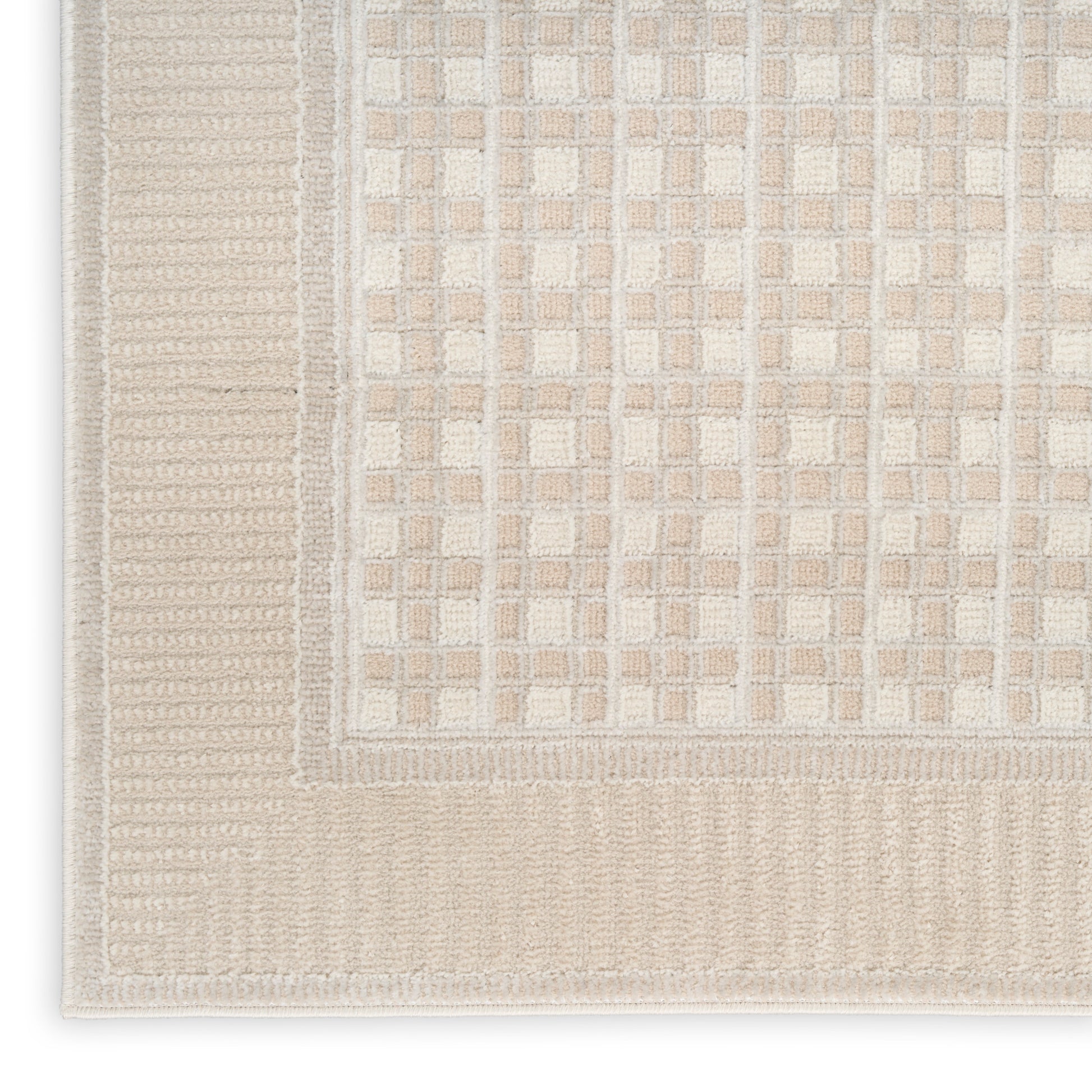 Beige and cream flatwoven rug with a tiled grid pattern and ribbed border.