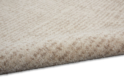 Beige rectangular shag rug with dense, plush high-pile texture for cozy living room decor.
