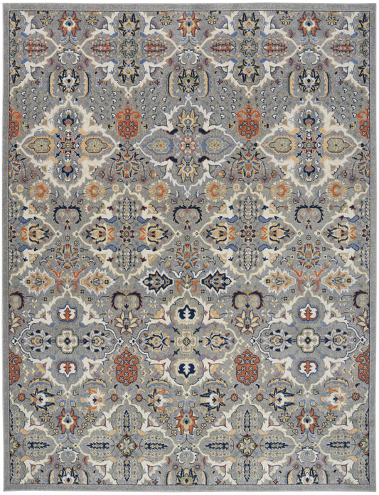 Persian-inspired area rug in blue-gray with ivory and orange floral medallions and intricate lattice motifs.