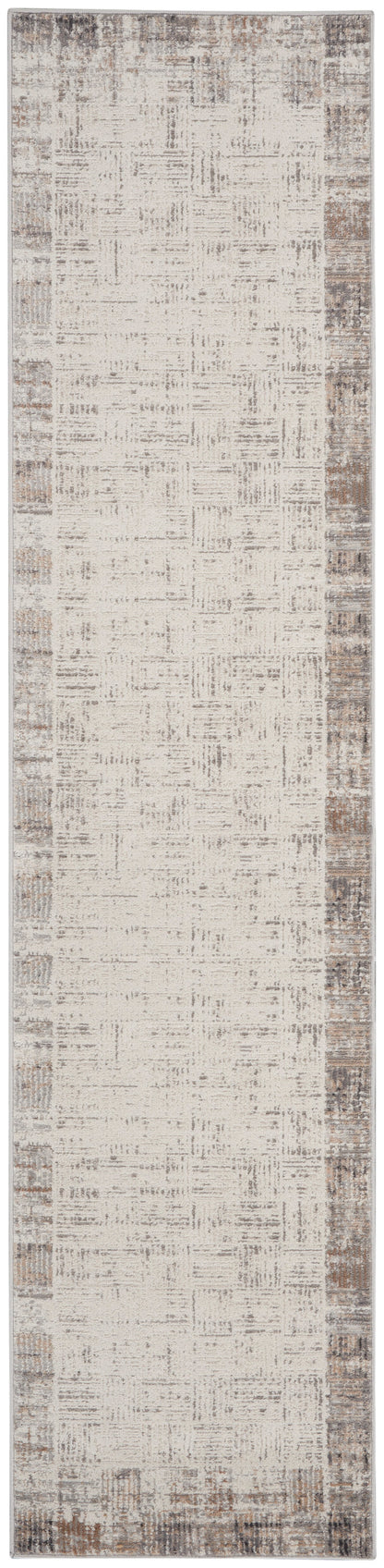 Long beige runner rug with distressed taupe-speckled texture and brown border; soft woven look.