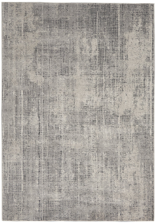 Gray distressed area rug with abstract pattern and subtle linear texture.