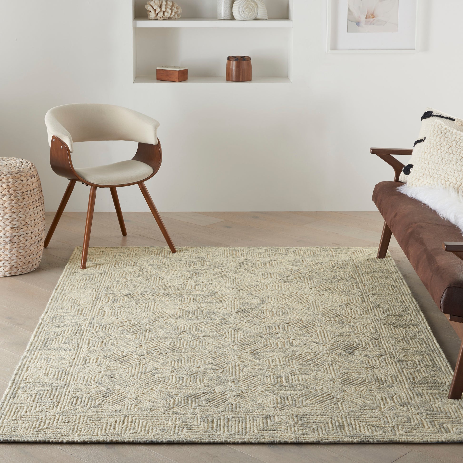 Beige textured geometric rug in a light living room, 4' x 6'.