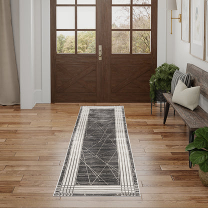 Dark wood double doors with glass panels; gray geometric runner rug on hardwood entryway, bench with cushions and greenery.