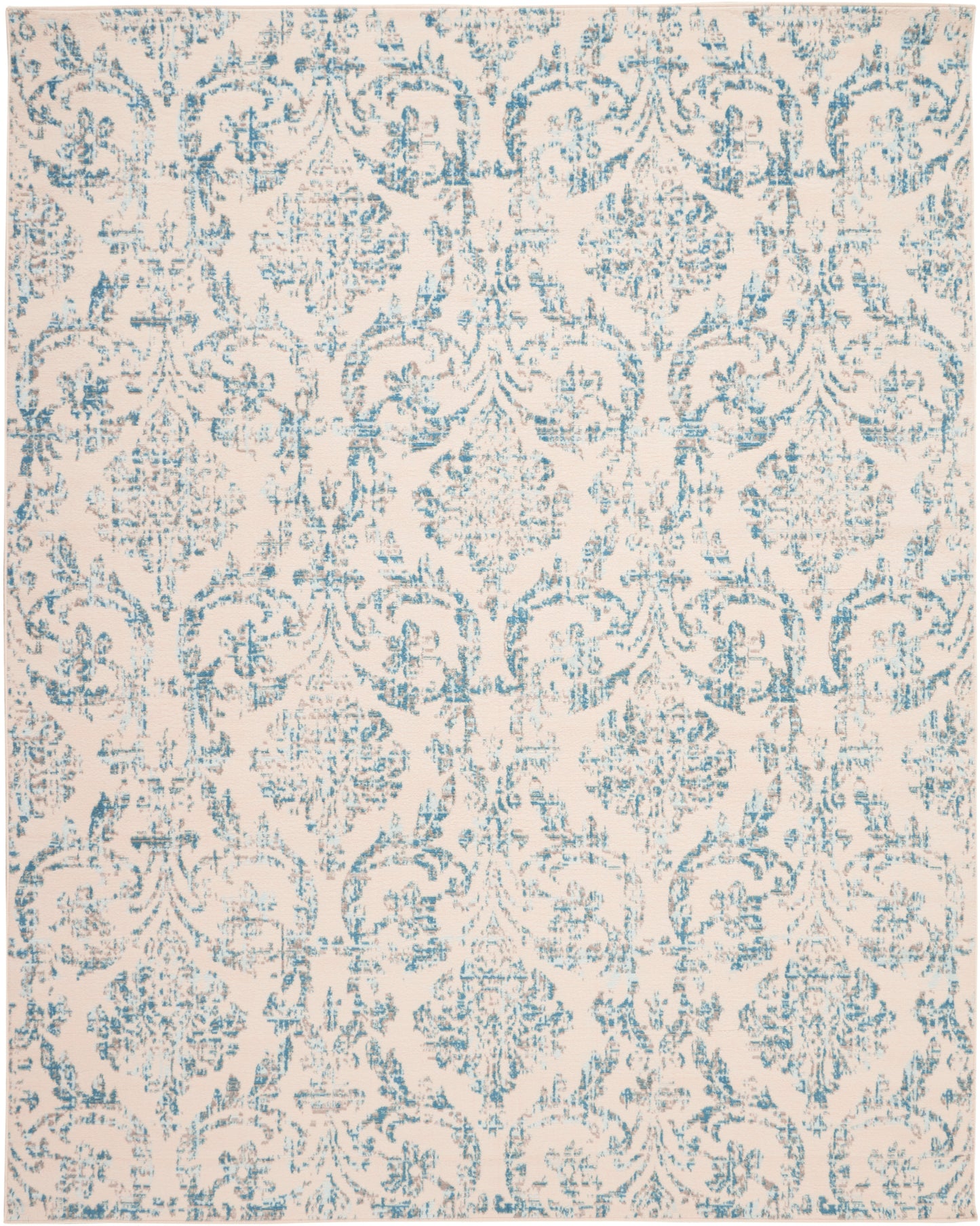 Light beige rug with blue damask floral pattern and scrolling medallions; elegant vintage-style decor.