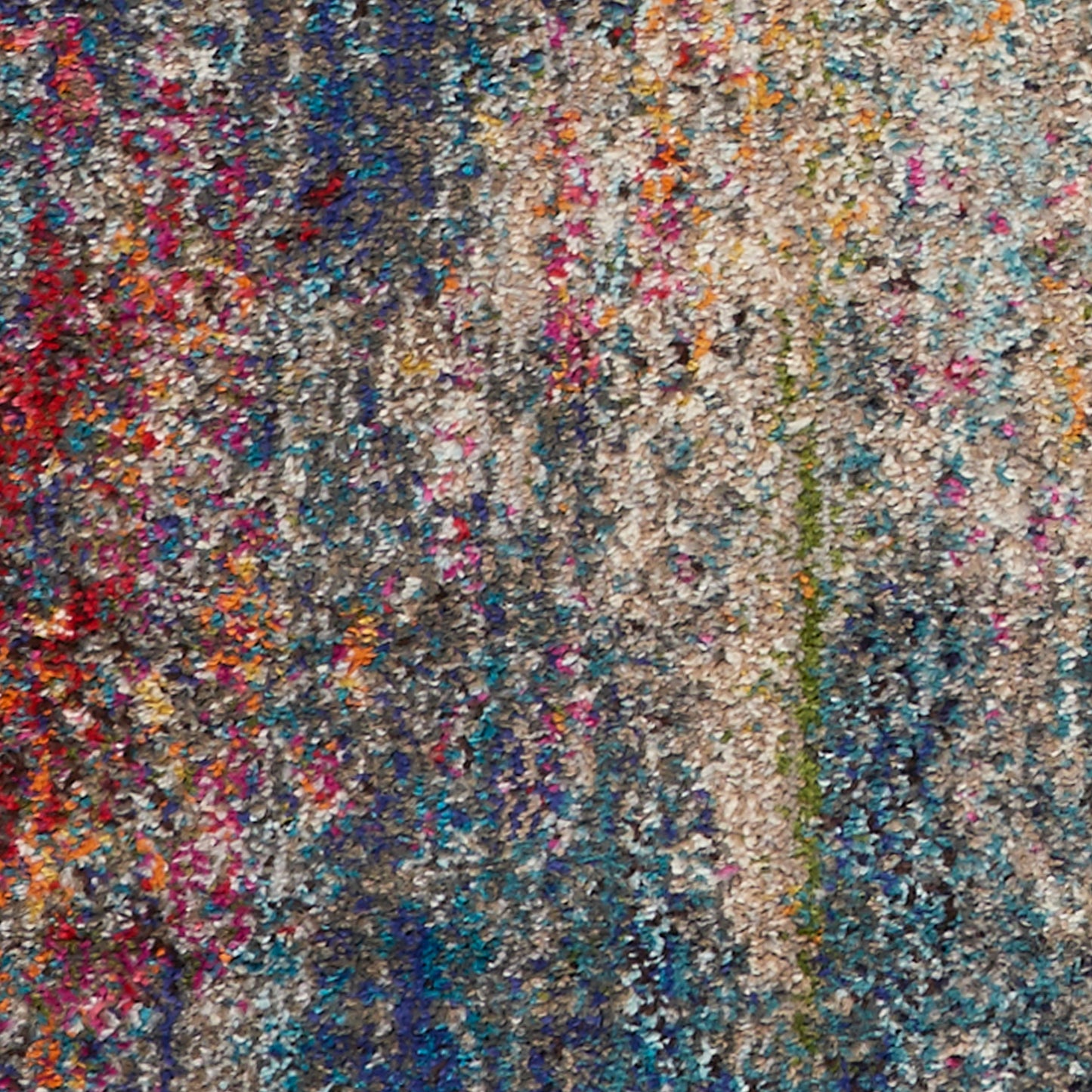 Dense multicolor shag rug with chunky looped fibers in blues, pinks, oranges and beige.