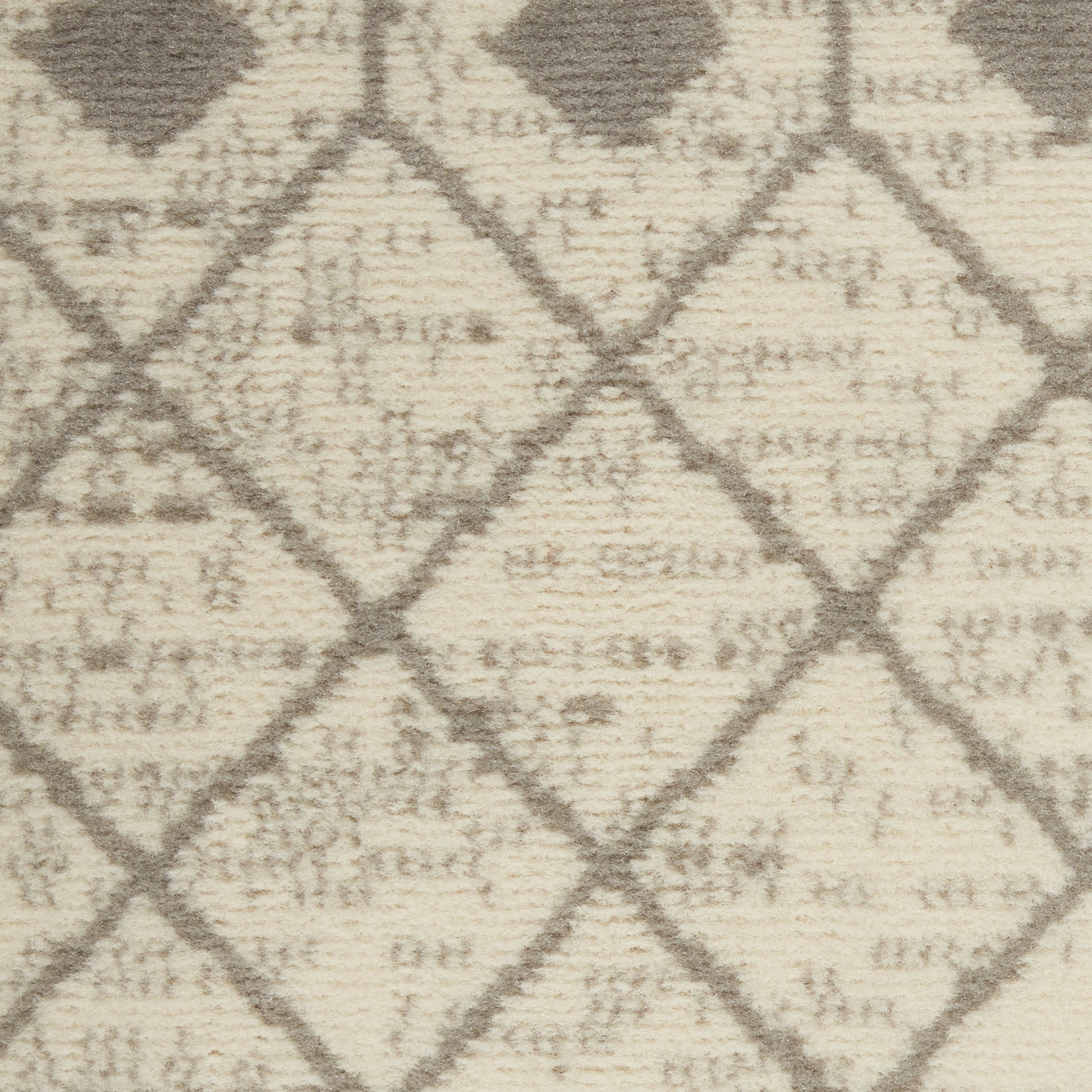 Cream-beige woven rug with taupe diamond lattice pattern and textured pile