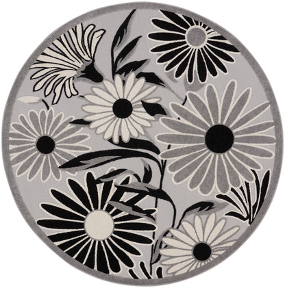 Round gray rug with black and white daisy floral pattern; contemporary circular area rug.