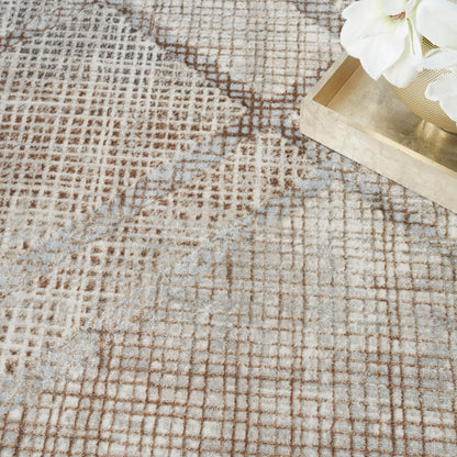 Beige and brown geometric rug with a grid pattern and textured weave; wooden tray with white flowers in the corner.