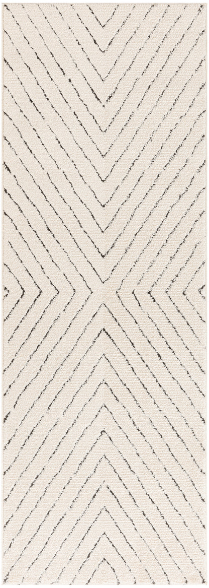 Rectangular beige shag rug with dark charcoal chevron lines for a bold zigzag pattern.