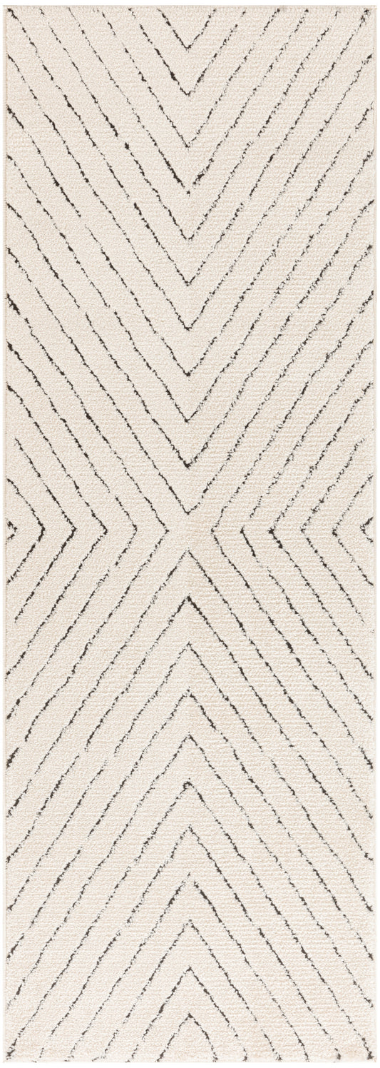 Rectangular beige shag rug with dark charcoal chevron lines for a bold zigzag pattern.